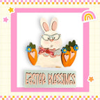 a picture of a bunny holding two carrots