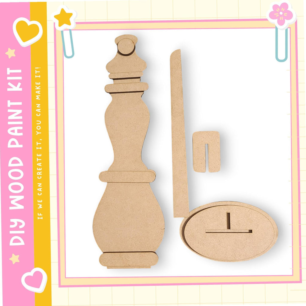 a DIY paint kit with a wooden figure and a wooden stick, all of which appear to be made of cardboard.