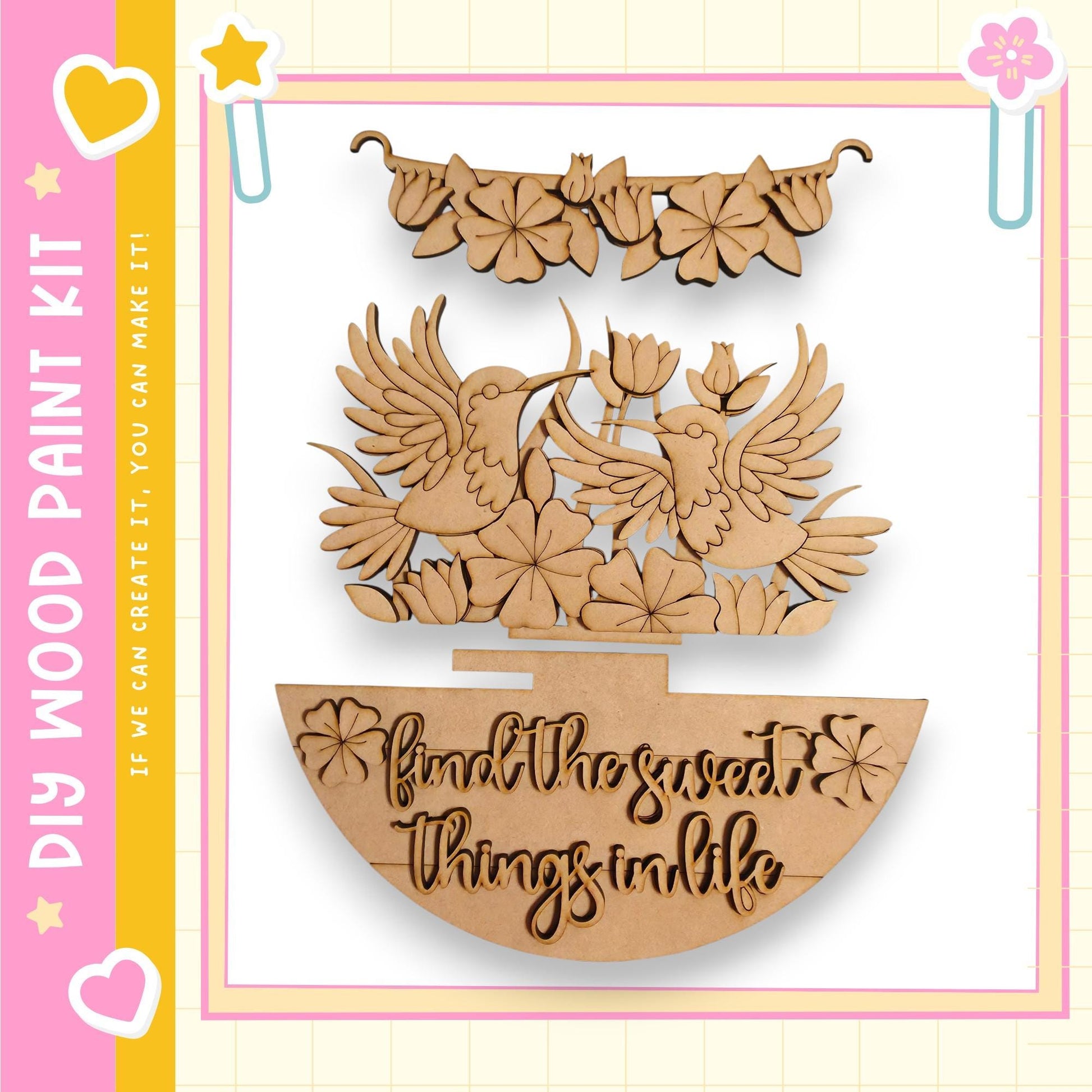 a wooden craft kit with a decorative design, including a pair of wooden birds, flowers, and a text message that reads "Find the sweet things in life".