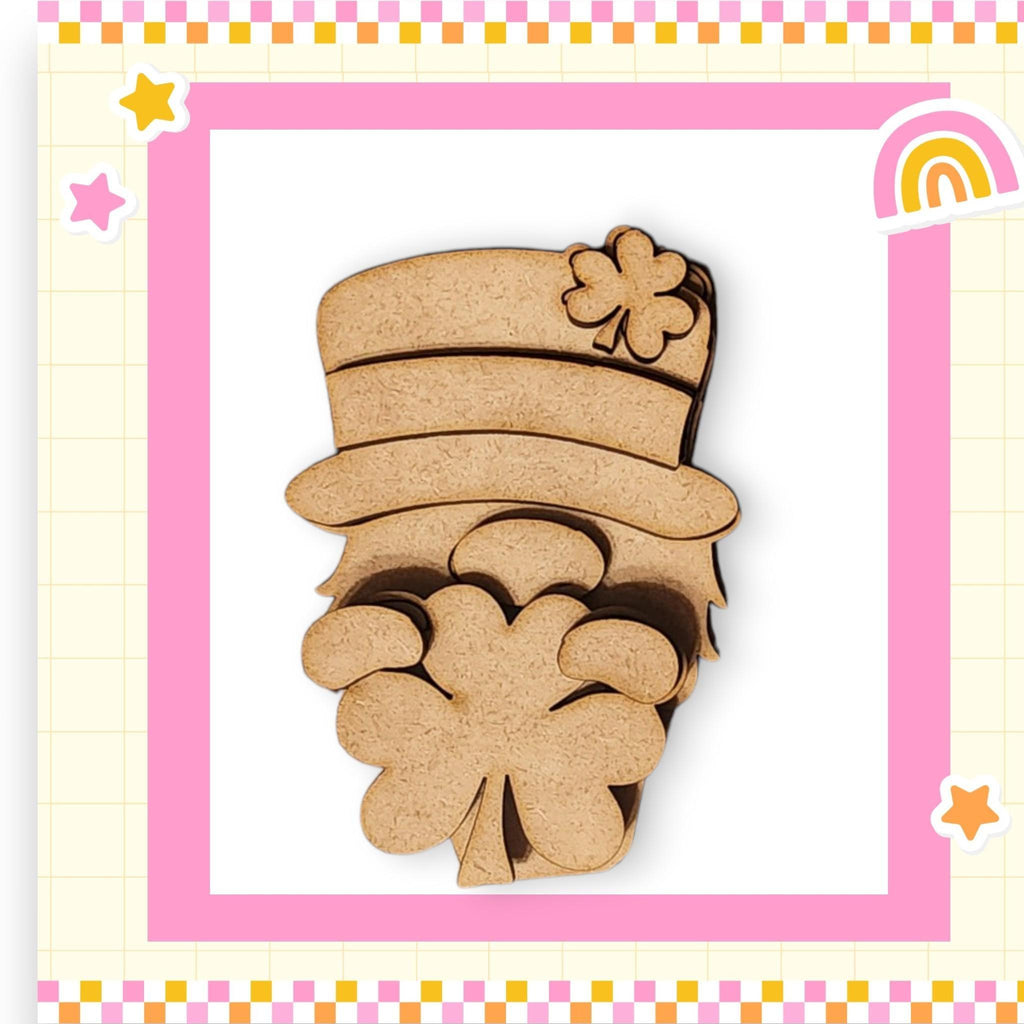 a wooden cutout of a lepreite with a rainbow in the background