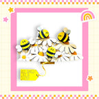 A cheerful arrangement of wooden bees on white flowers, with a yellow tag that reads "Bee Sweet Like a Daisy".