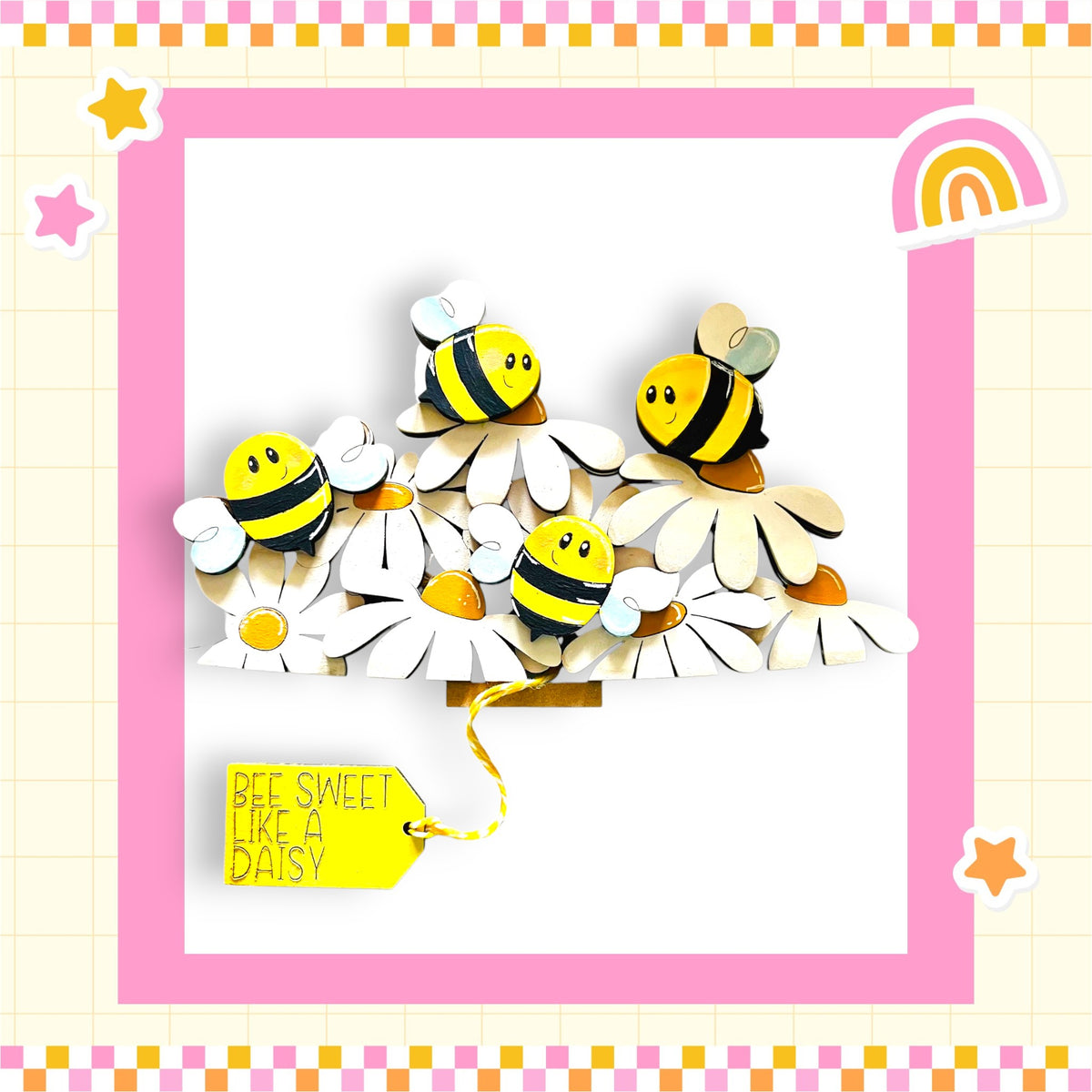 A cheerful arrangement of wooden bees on white flowers, with a yellow tag that reads "Bee Sweet Like a Daisy".