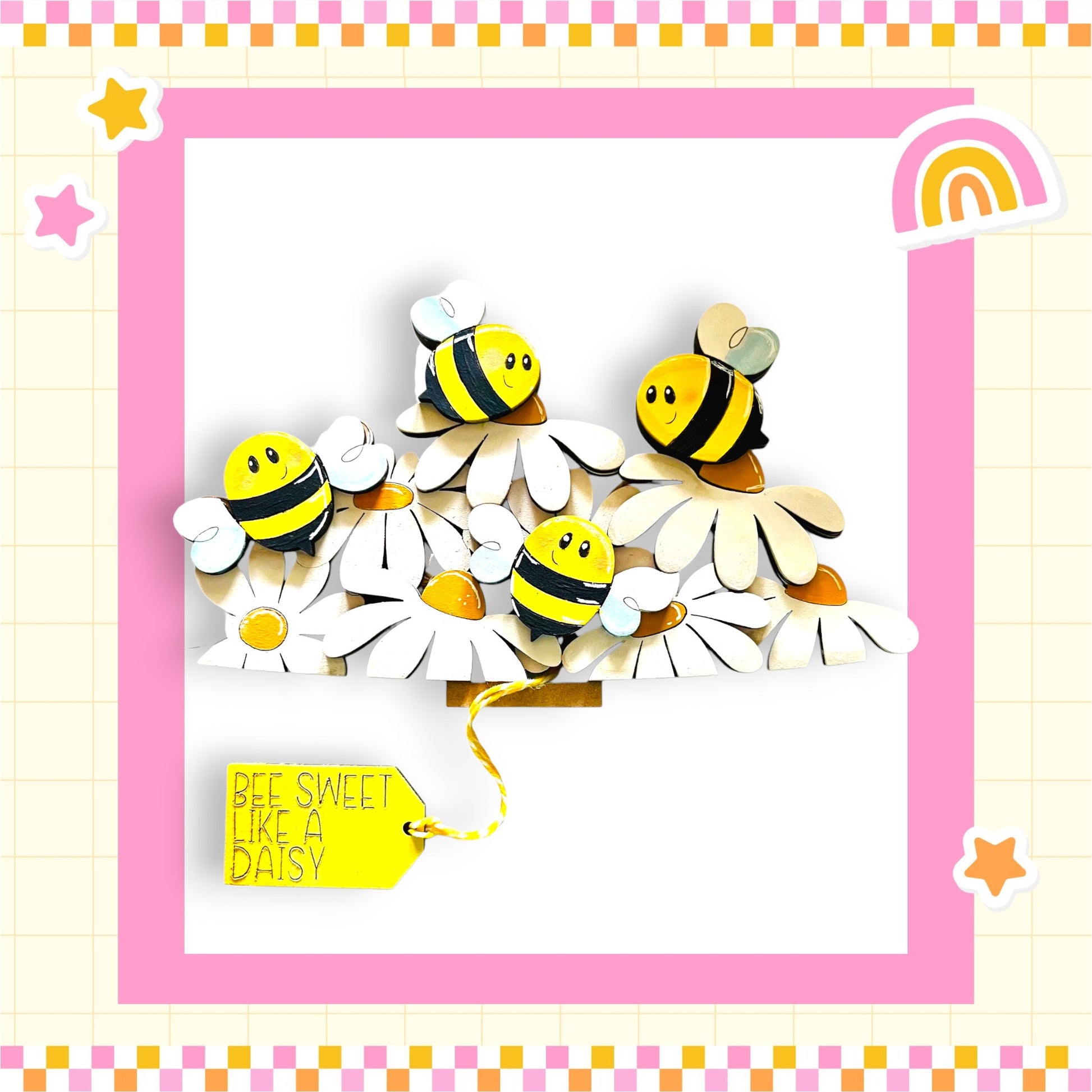 A cheerful arrangement of wooden bees on white flowers, with a yellow tag that reads "Bee Sweet Like a Daisy".