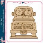 A wooden sign with the text "Chillin' together Frosty" carved into it, featuring two cartoon characters in the back of a truck.