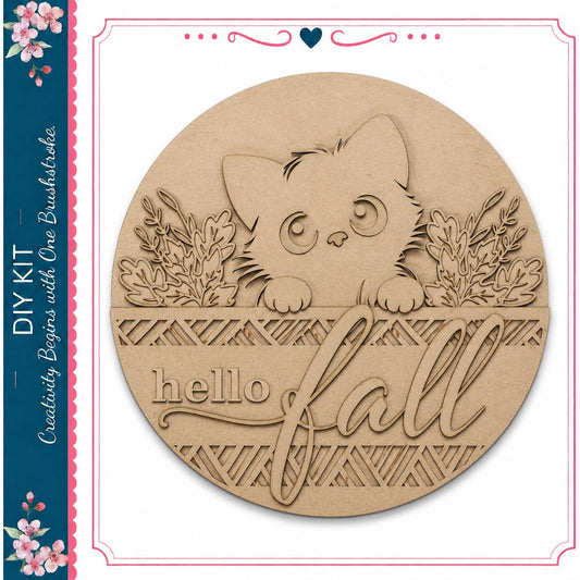 A wooden sign with a cat's face and the text "Hello Fall" carved into it.