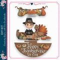 A cheerful illustration of a young boy dressed in a Pilgrim's outfit, surrounded by various autumn-themed objects such as pumpkins, gourds, and a turkey. The text "Happy Thanksgiving to you" is displayed prominently in the image.