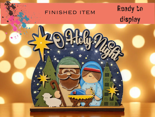 The image is a finished item, ready to be displayed, featuring a nativity scene with a man, a woman, and a baby.