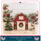 A rustic farmhouse-style decoration with a Christmas tree, a windmill, and a wreath, all set against a backdrop of pine trees and red berries.