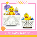 The image is a DIY wood paint kit featuring two cute duck illustrations in baskets, with a pink and white striped border.