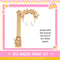 a picture of a wooden craft kit with a picture of an arch