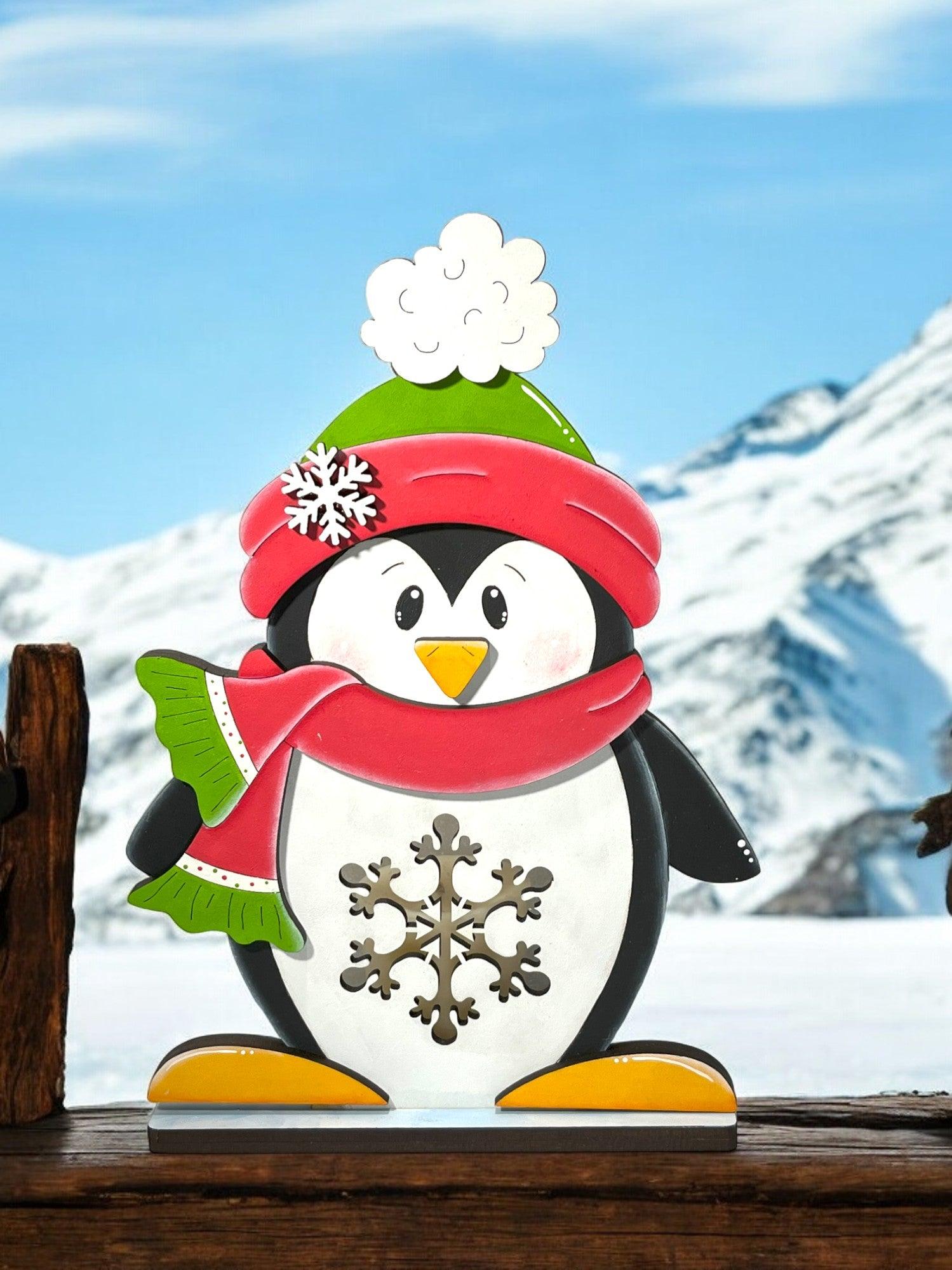 a penguin with a hat and scarf on