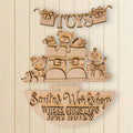 A wooden sign with the text "Toys" and "Santa's Workshop Where Christmas Magic Happens" carved into it, along with various toys and decorations.