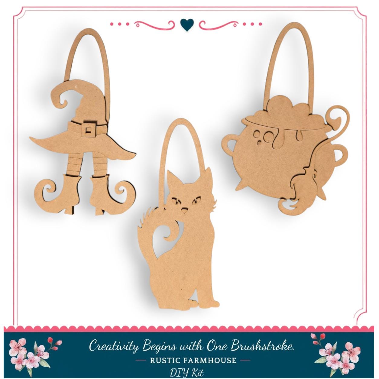three wooden cutouts of Halloween-themed objects, including a witch's hat, a cauldron, and a cat, arranged in a row.