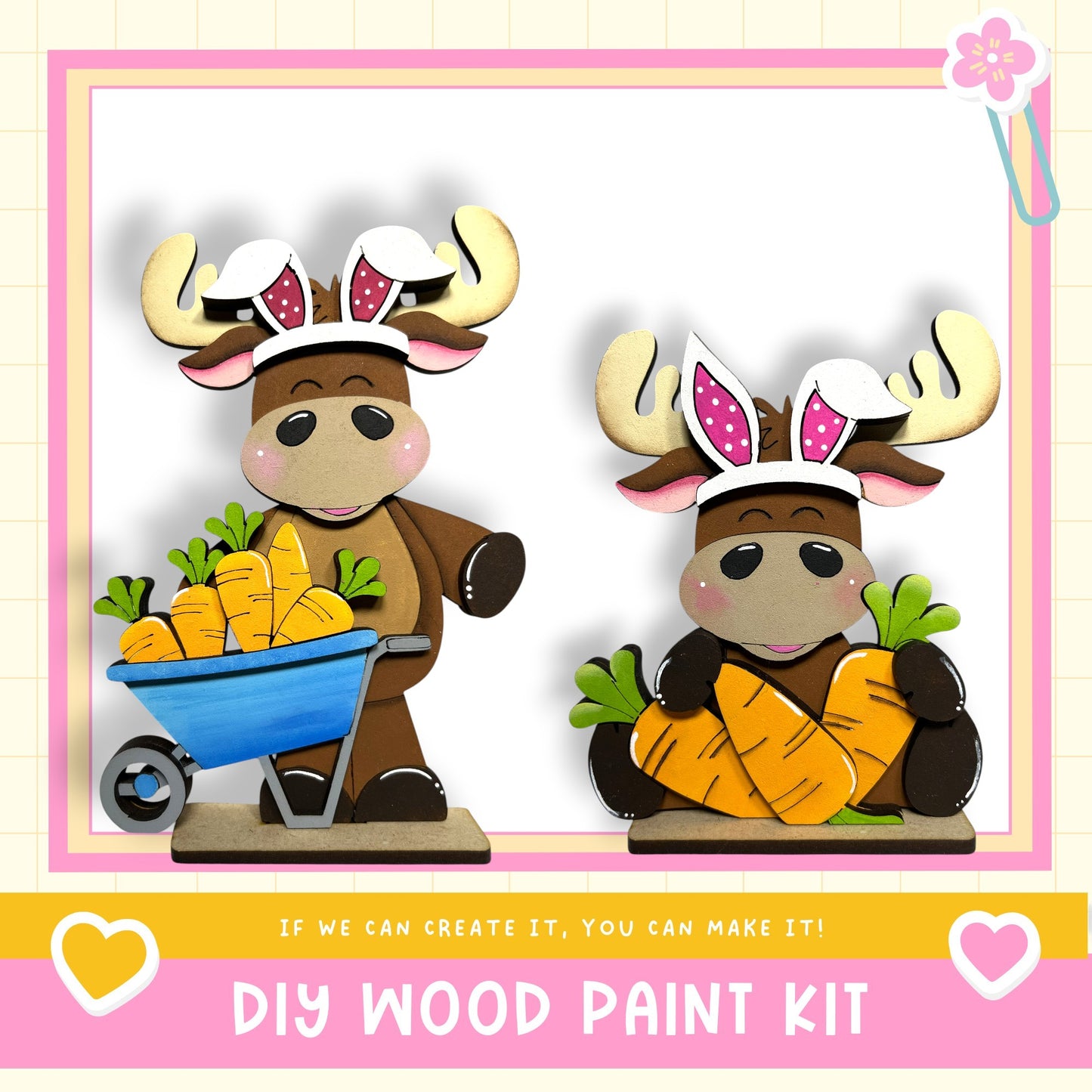 two wooden moose figurines, each holding a carton of carrots, set against a pink and white background.