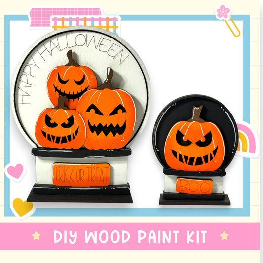 A Halloween-themed DIY wood paint kit featuring a spooky pumpkin decoration with a "Happy Halloween" message and a "Trick or Treat" sign.
