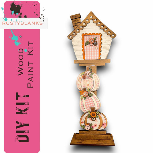 a clock with a birdhouse on top of it