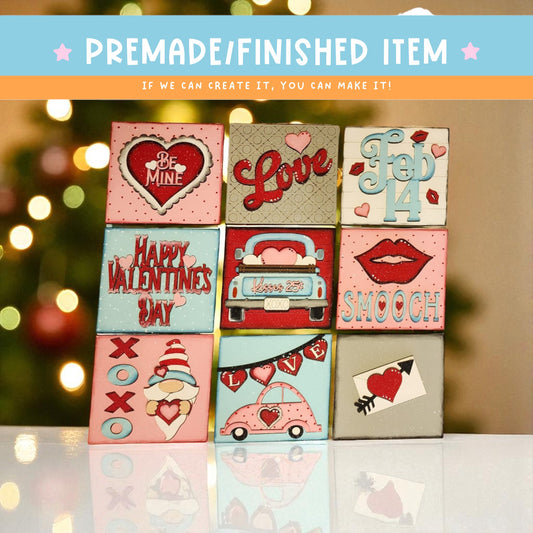 The image is a collection of nine small, square-shaped items with various Valentine's Day-themed designs, including hearts, cars, and text.