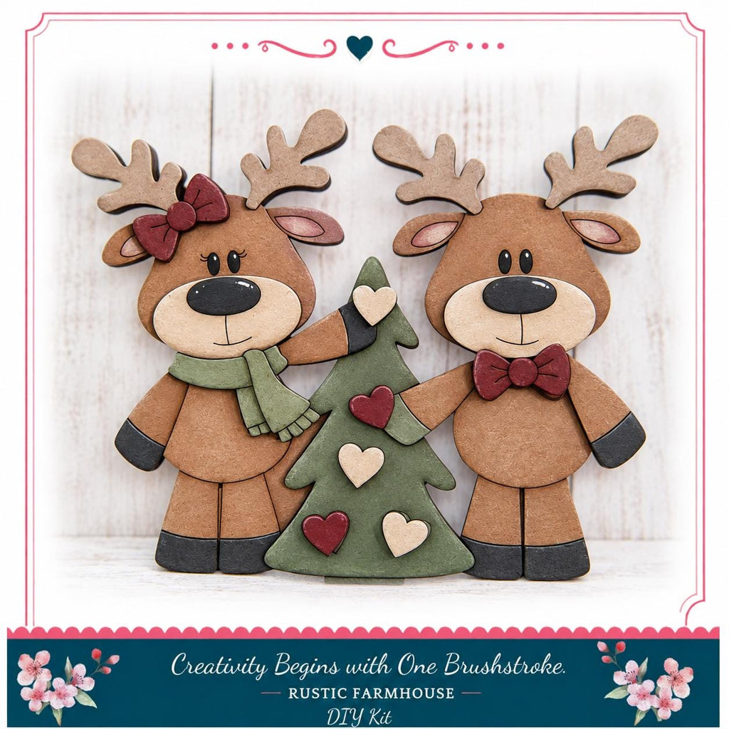 Two wooden reindeer figurines, one with a bow and the other with a heart-shaped bow, standing next to a Christmas tree decorated with red and white hearts.