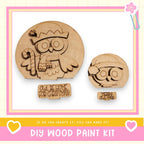 a DIY wood paint kit for creating wooden owls, with two owl-shaped cutouts and a sign that reads "Owl be home for Christmas".