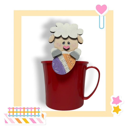 a red cup with a picture of a sheep sticking out of it