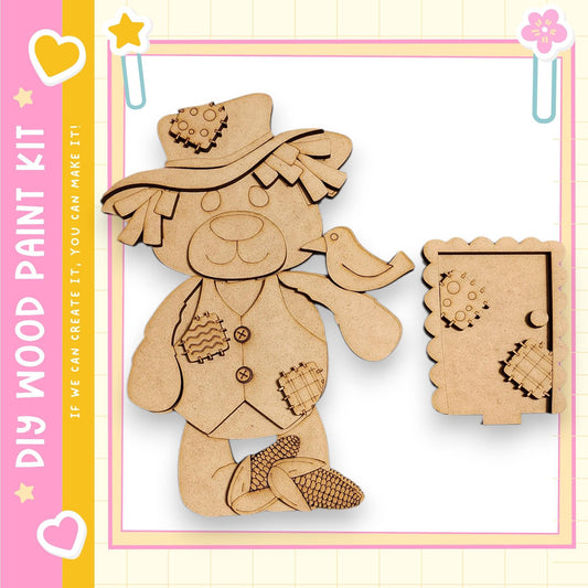 a wooden toy bear wearing a hat and holding a bird.