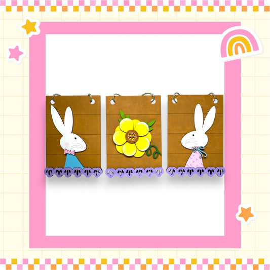 A collage of three framed pictures featuring cartoon rabbit characters, with a yellow flower in the center.