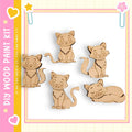 a collection of five wooden cat figurines, each with a unique pose, arranged in a row against a white background.