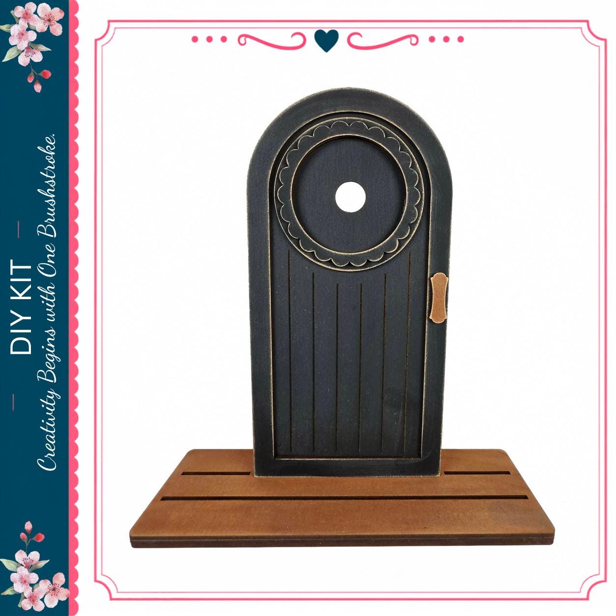 a black wooden door with a circular window, standing on a wooden platform.