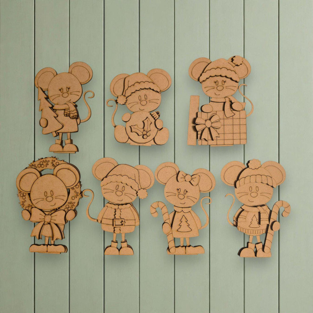A collection of six wooden mouse figurines, each with unique features and accessories, displayed against a light green background.