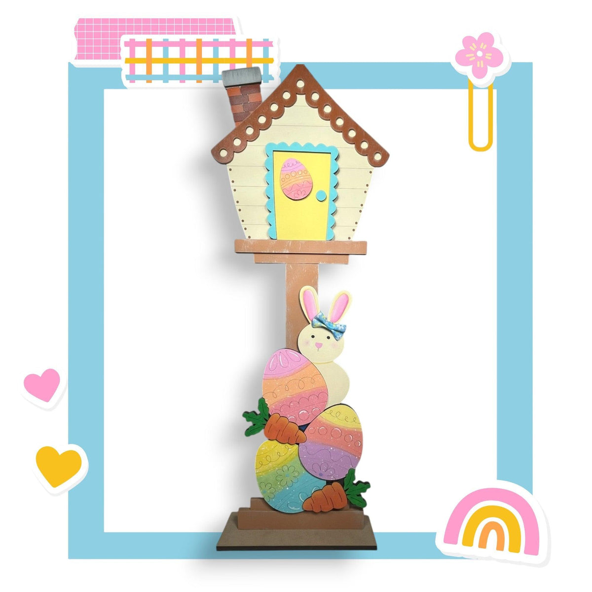 a paper sculpture of a bunny and a house