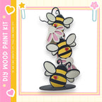 A colorful and whimsical painting kit featuring a playful arrangement of cartoon-style bees on a wooden base.