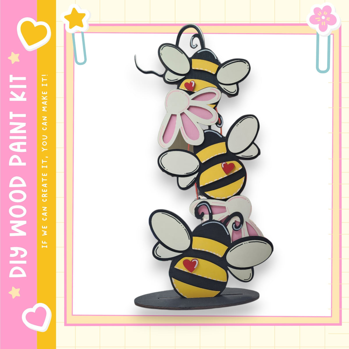 A colorful and whimsical painting kit featuring a playful arrangement of cartoon-style bees on a wooden base.