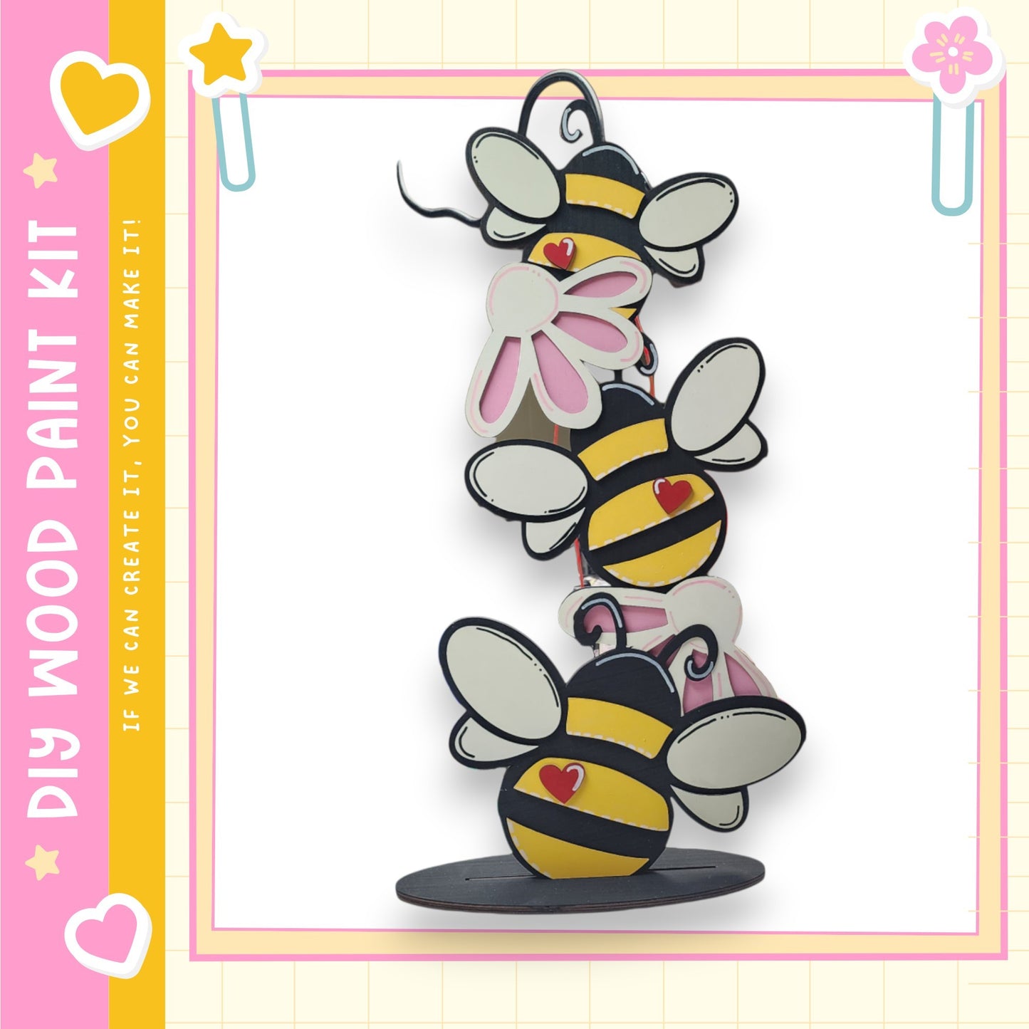 A colorful and whimsical painting kit featuring a playful arrangement of cartoon-style bees on a wooden base.