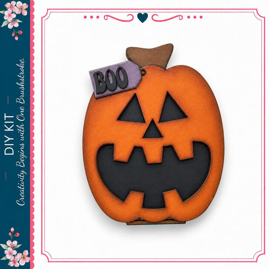 a carved pumpkin with a carved face and the word "BOO" written on it.