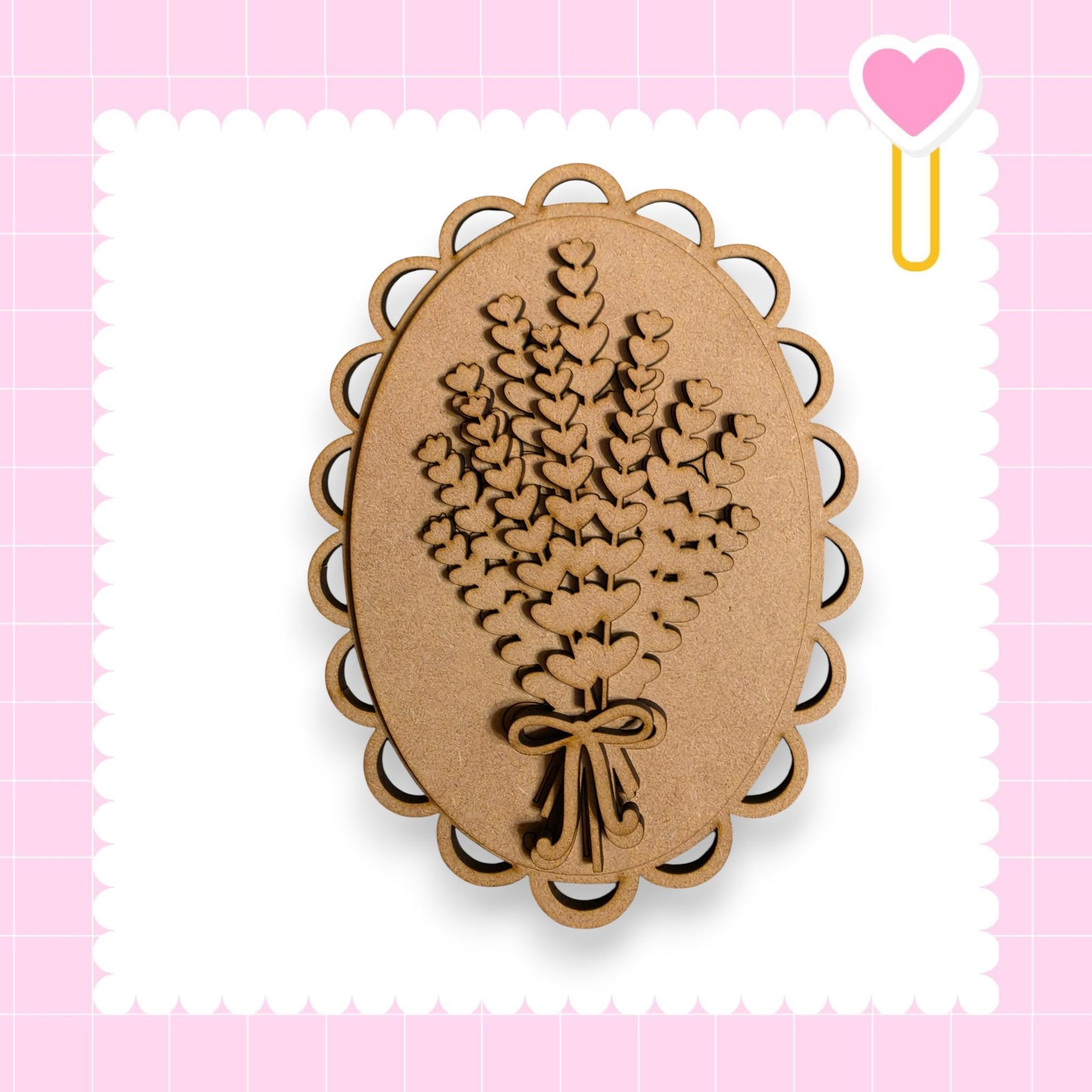 a wooden oval-shaped object with a heart-shaped cutout in the center, surrounded by a scalloped edge.