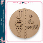 The image is a circular wooden sign with the word "Joy" carved into it.