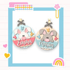 a picture of a couple of earrings with animals on them
