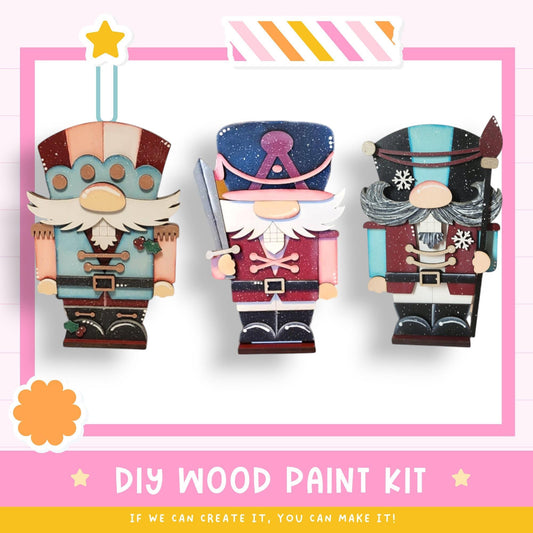 a couple of wooden toy figurines sitting next to each other