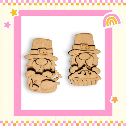 two wooden gnome figurines wearing hats, one with a pie in its hands, set against a pink and yellow checkered background with stars and a rainbow.