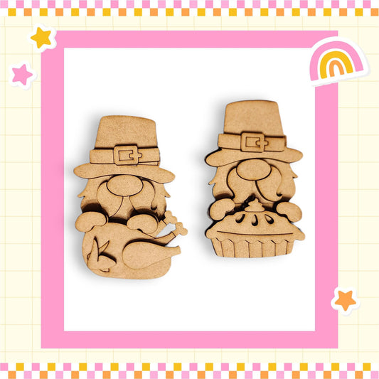 two wooden gnome figurines wearing hats, one with a pie in its hands, set against a pink and yellow checkered background with stars and a rainbow.