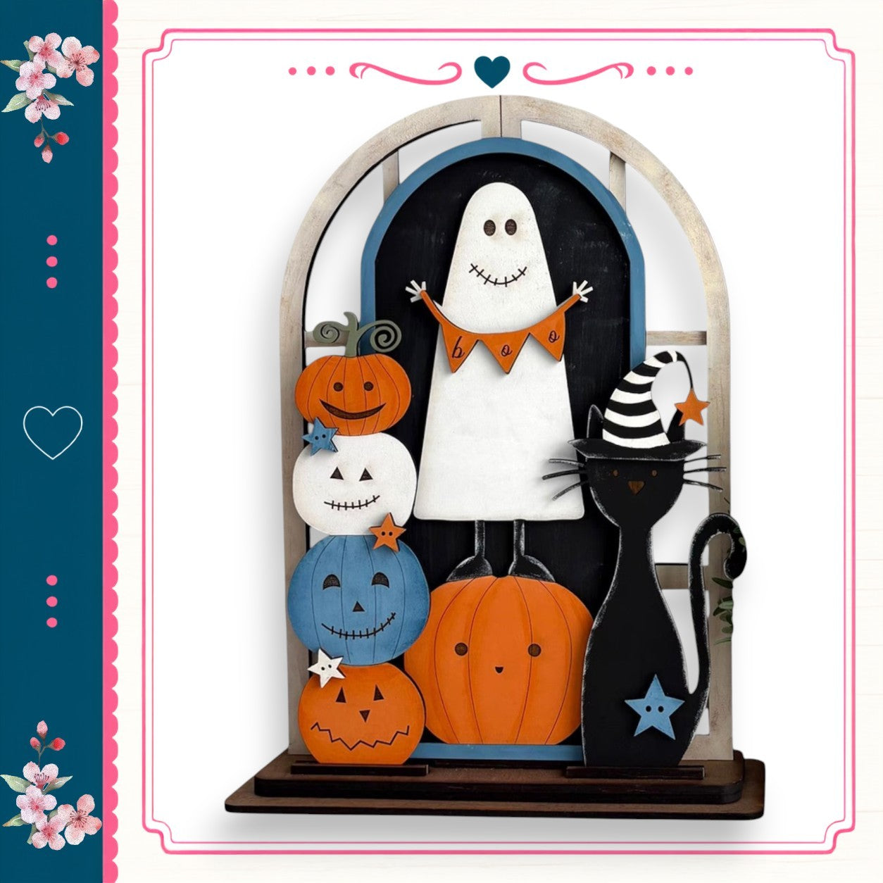 A Halloween-themed display featuring a ghost, a cat, and various pumpkins and a star, all set against a white background.