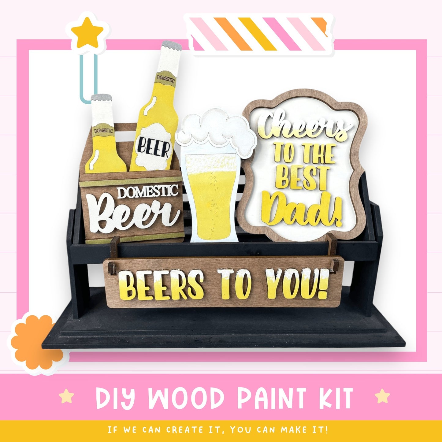 a DIY wood paint kit for creating a beer-themed sign or decoration. The kit includes various wooden elements, such as beer bottles and a beer glass, as well as a sign that says "Cheers to the best Dad!" The kit is designed to be used for creating a personalized beer-themed decoration or gift.