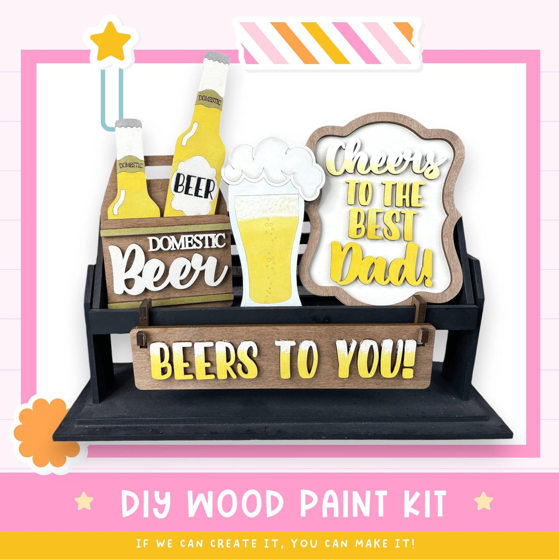 a DIY wood paint kit for creating a beer-themed sign or decoration. The kit includes various wooden elements, such as beer bottles and a beer glass, as well as a sign that says "Cheers to the best Dad!" The kit is designed to be used for creating a personalized beer-themed decoration or gift.