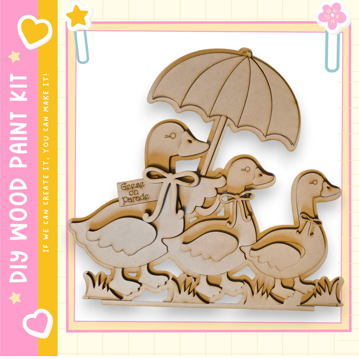 A wooden cutout of three ducks walking together under an umbrella, with a sign attached to the umbrella that says "Goose on Parade".