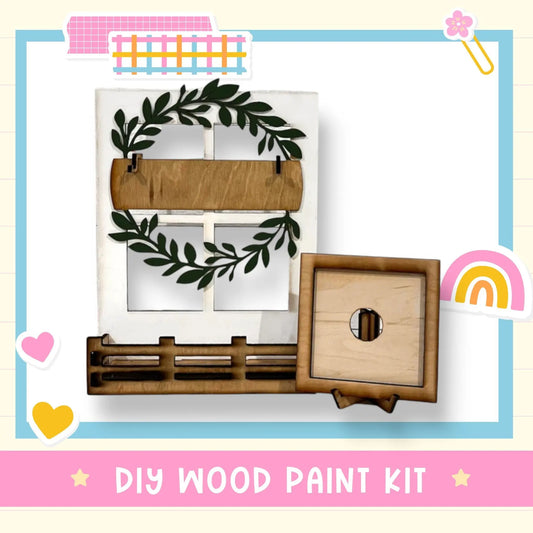 a diy wood paint kit with a wreath