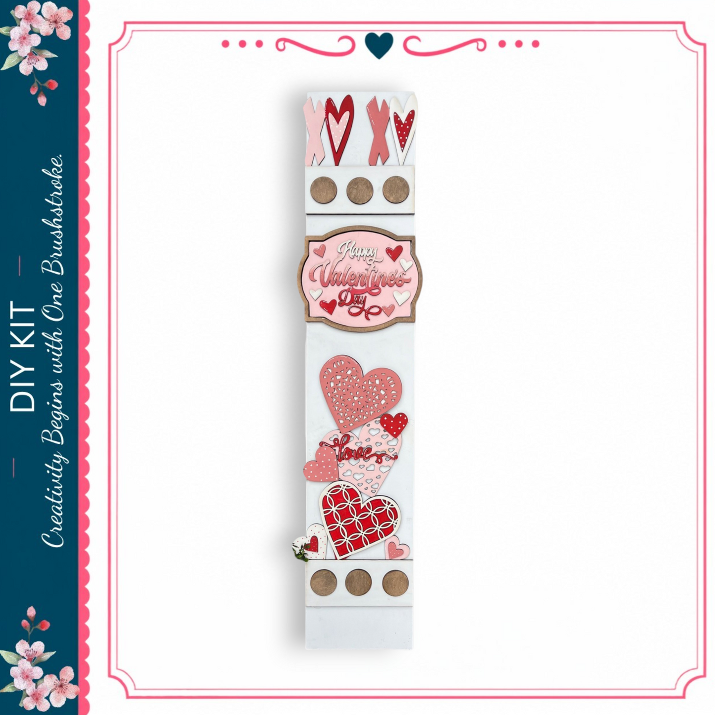 a white sign with various heart-shaped decorations and text, including the words "Happy Valentine's Day" and "DIY Kit".