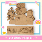 a wooden cutout of a woman with a hat and flowers