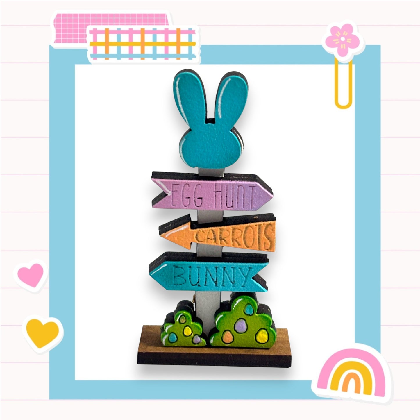 A colorful wooden signpost with directional signs for Easter egg hunt, carrots, and bunny, surrounded by various Easter-themed stickers and decorations.