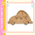 A wooden car-shaped object is displayed against a pink and yellow background, with a text box containing the text "My Wood Paint Kit" and a heart symbol.