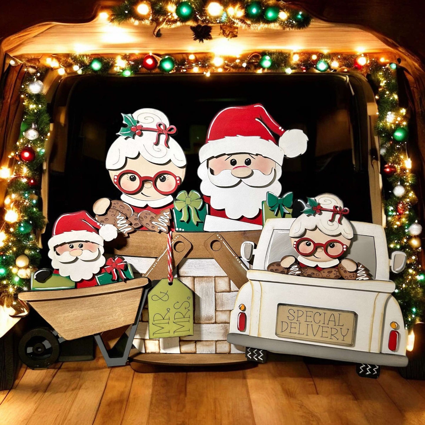 a group of paper cut outs of santas in a truck